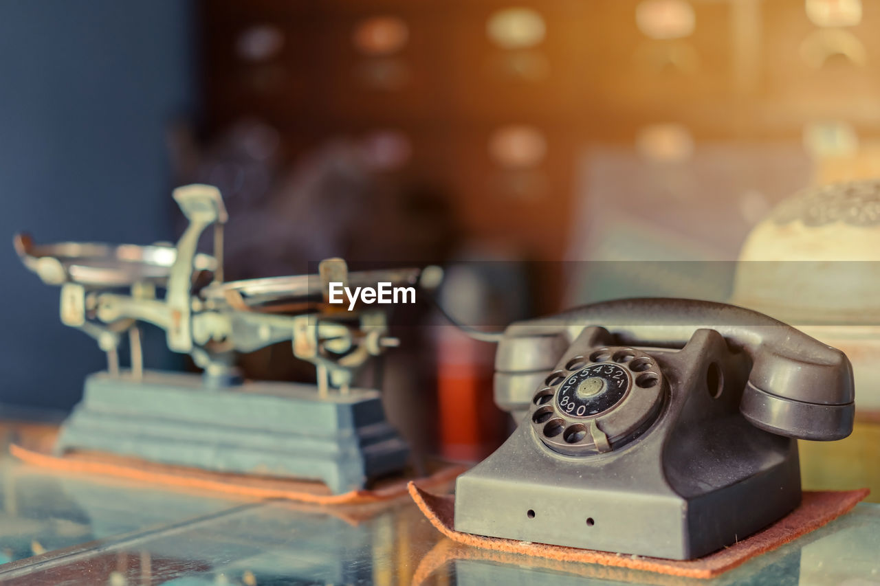 Close-up of telephone on table