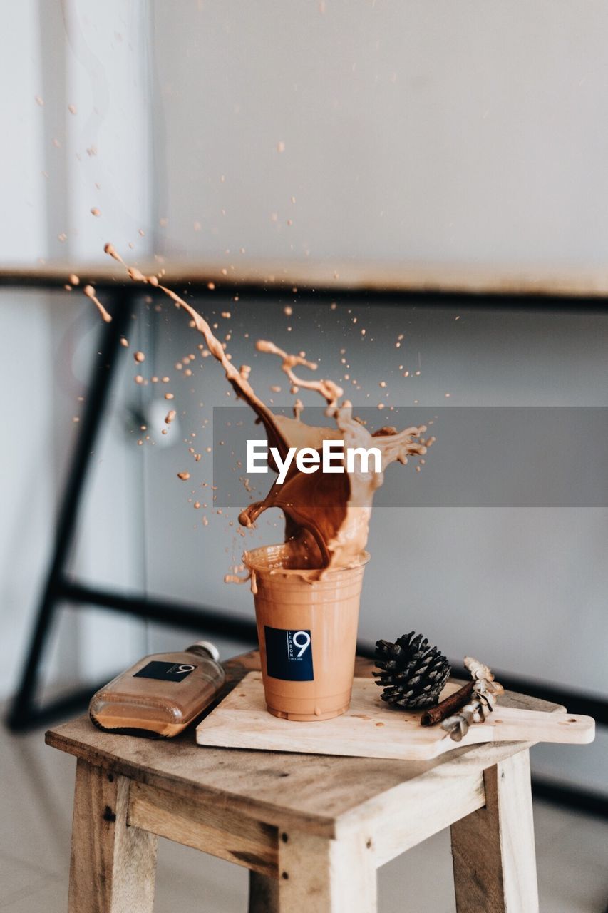 Close-up of coffee splashing on table