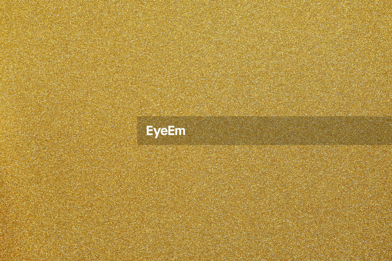 Gold glitter texture background - golden textured pattern