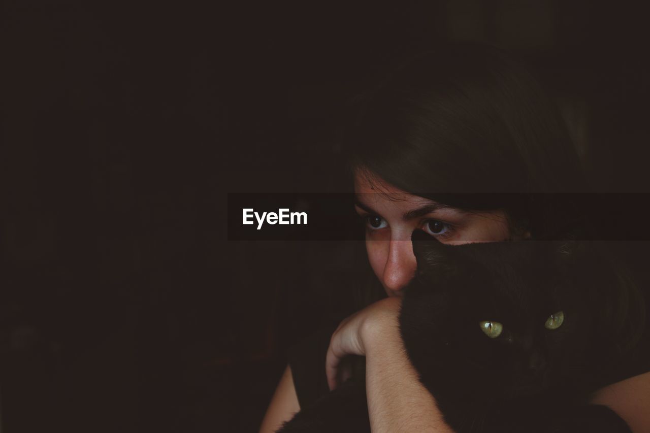 Close-up of woman holding cat