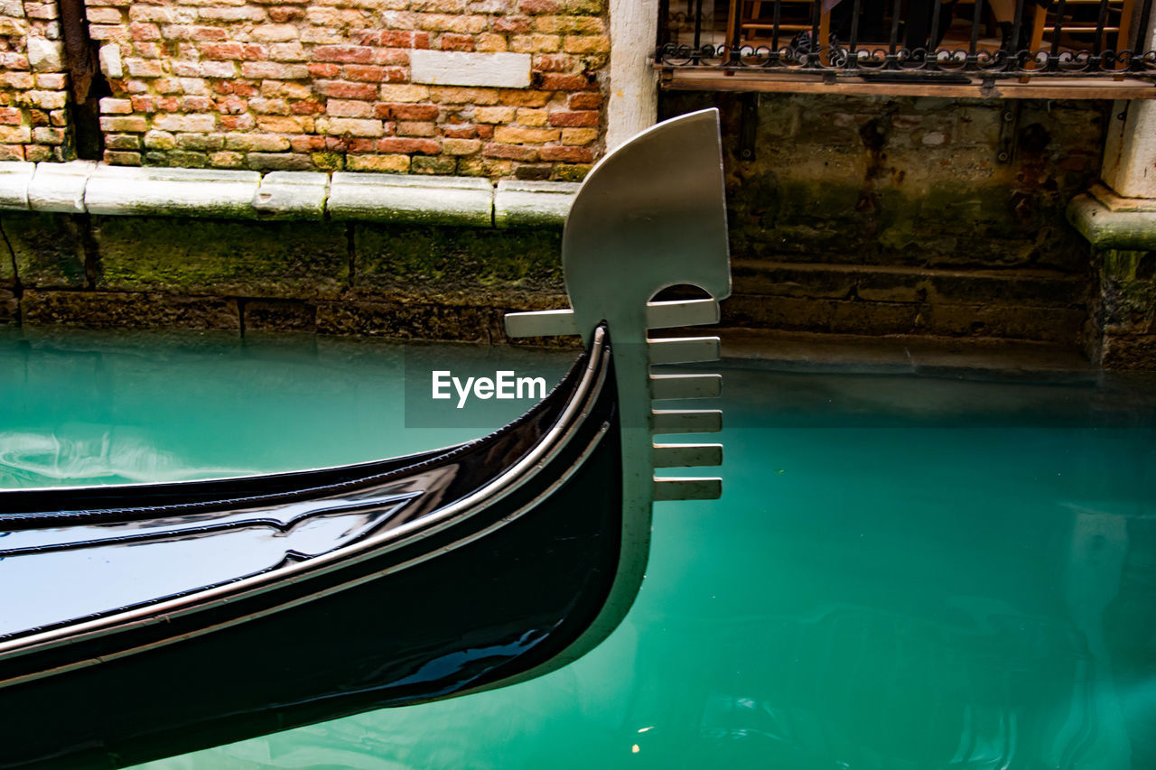 VIEW OF SWIMMING POOL AGAINST CANAL