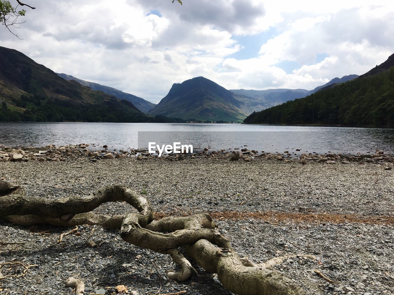 VIEW OF LAKE AGAINST MOUNTAIN RANGE