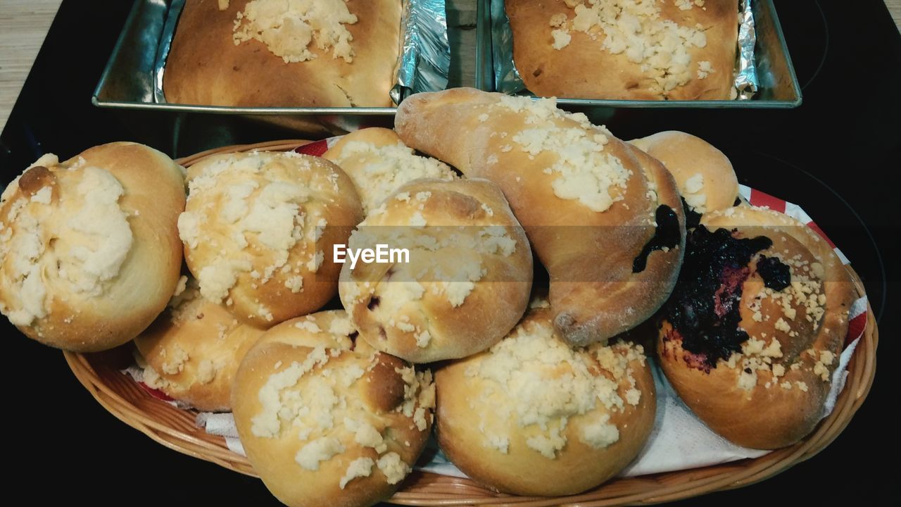 High angle view of donuts and cake in container on table