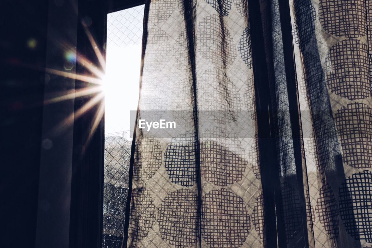 Sun shining through curtain