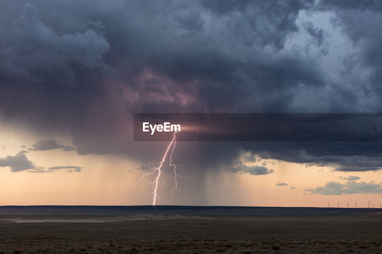 Thunderstorm lightning at sunset near vaughn, new mexico