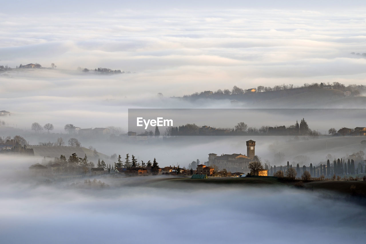 Scenic view of levizzano castle with sea of clouds during foggy weather