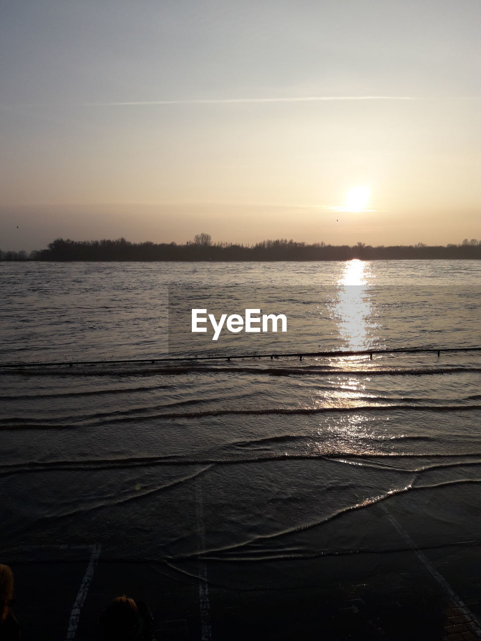 SCENIC VIEW OF LAKE AT SUNSET