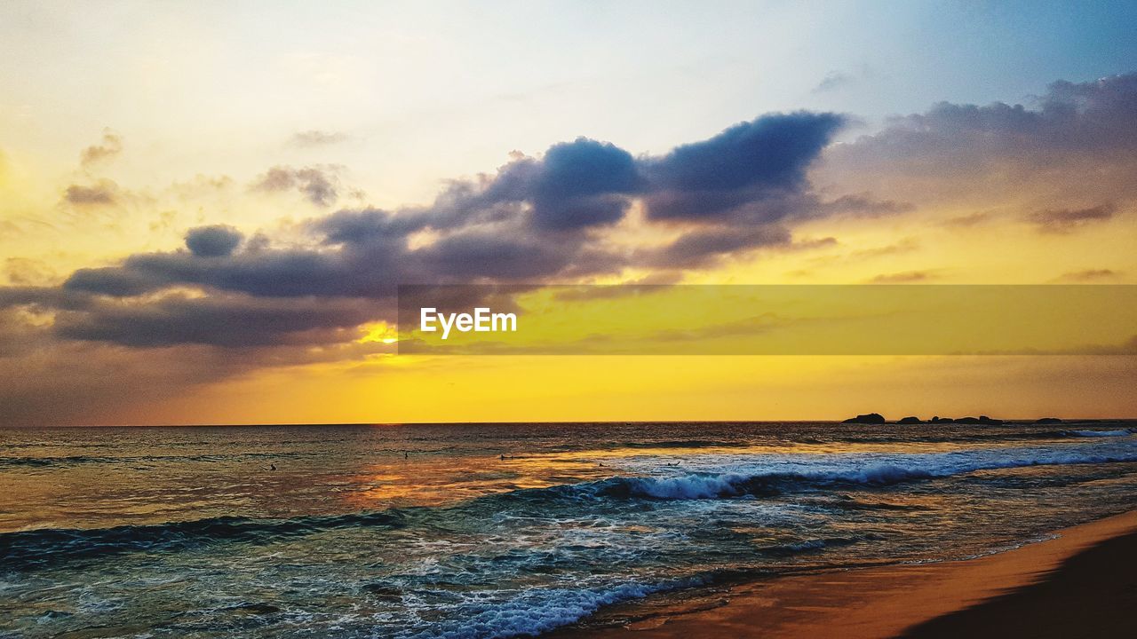 Scenic view of sea against sky during sunset