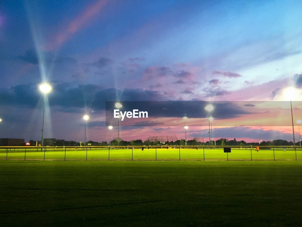 Illuminated floodlights at stadium