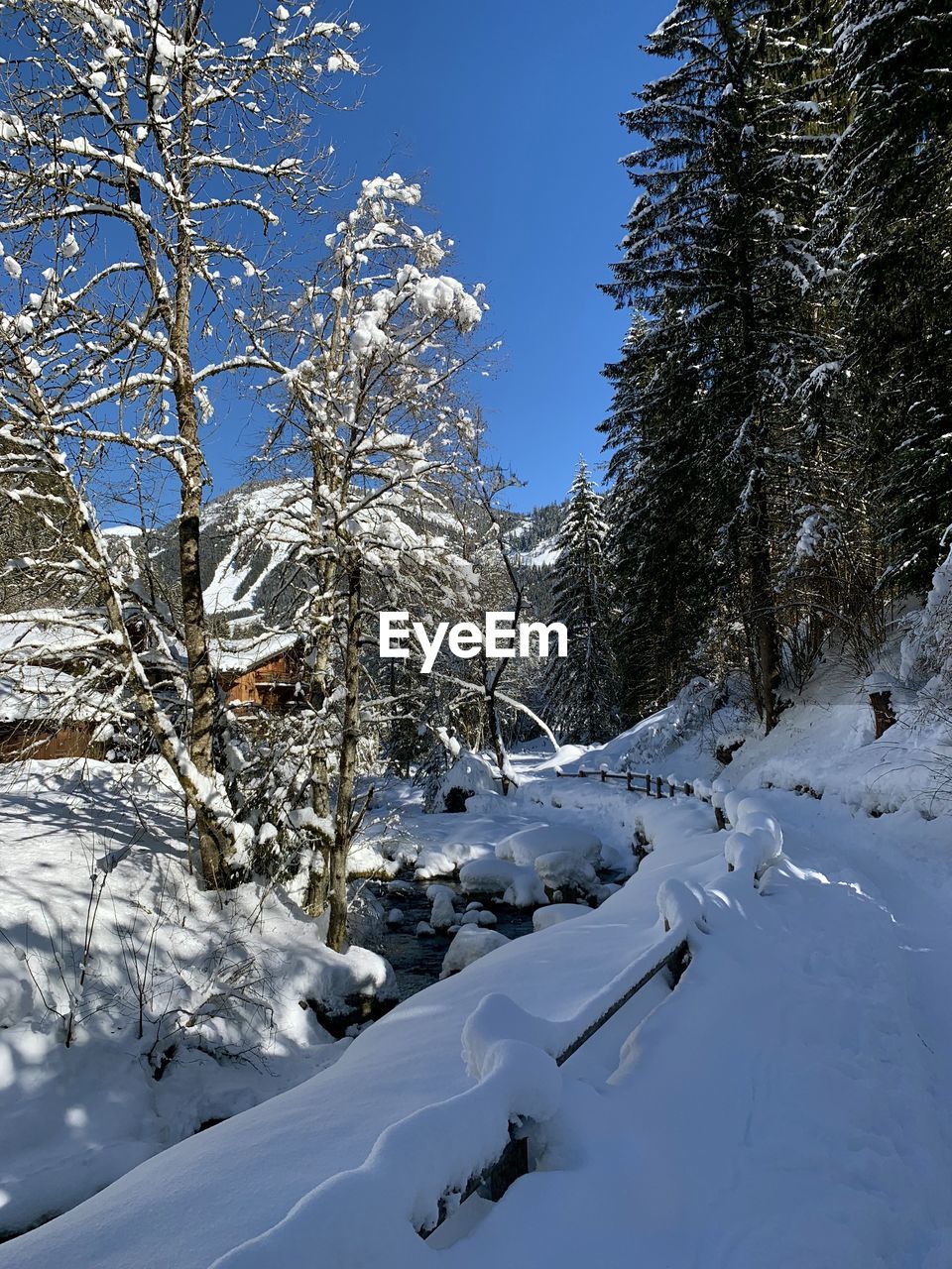 SNOW COVERED LAND AGAINST SKY