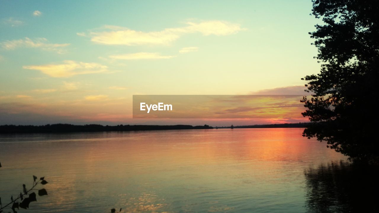 SCENIC VIEW OF LAKE DURING SUNSET