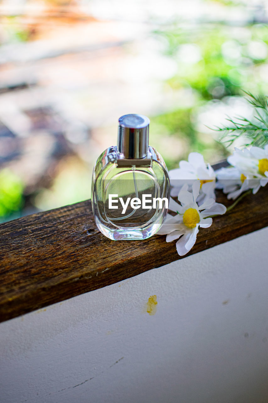 Perfume spray bottle and flower 