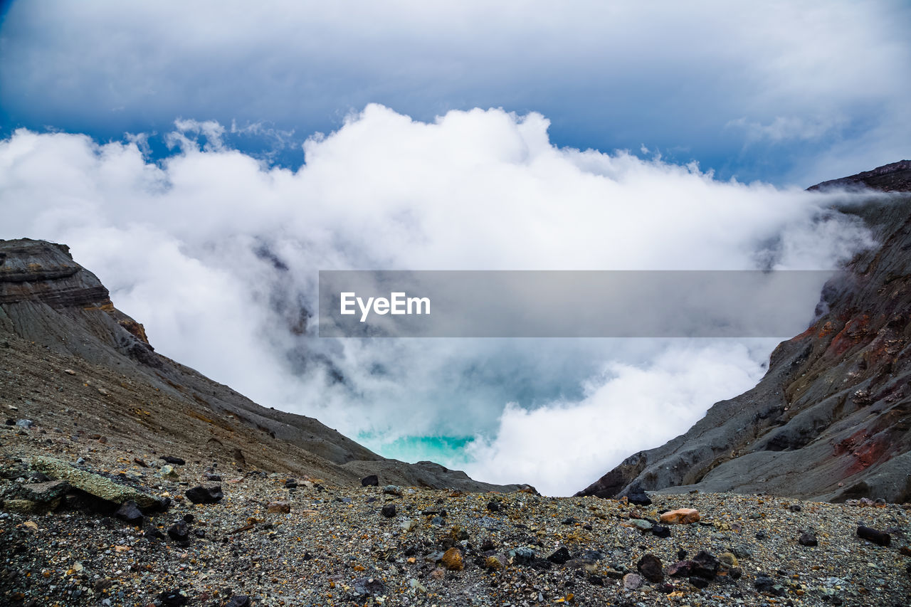 Heavy smoke comes from an active volcano crater in kyushu, japan