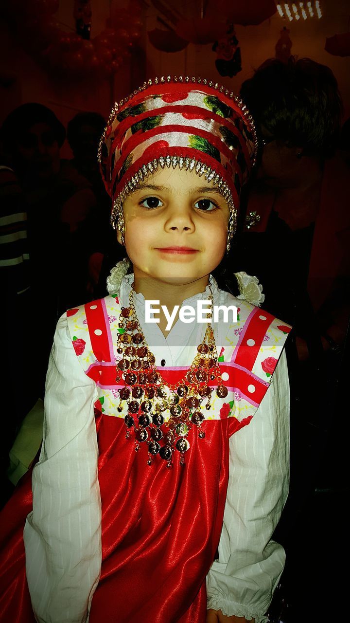 Portrait of smiling girl wearing sarafan at event