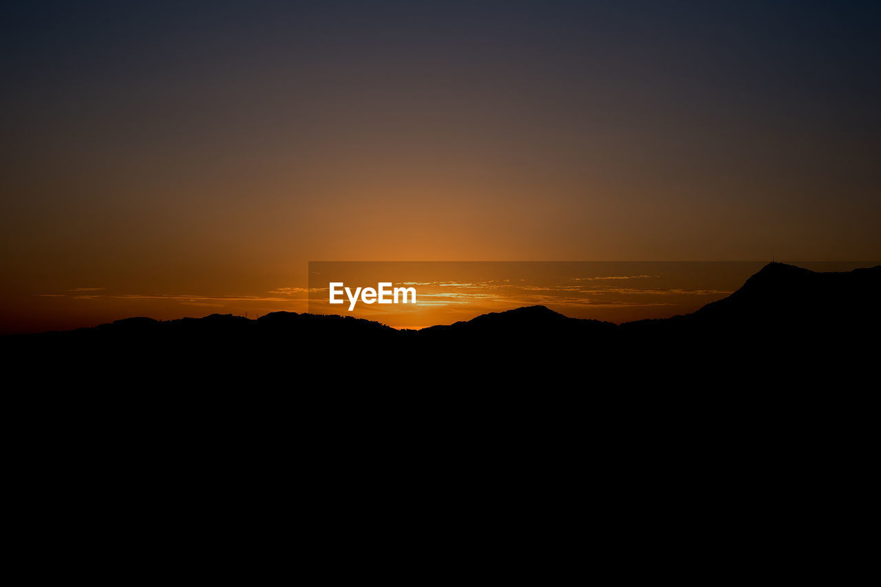 SUNSET OVER MOUNTAINS