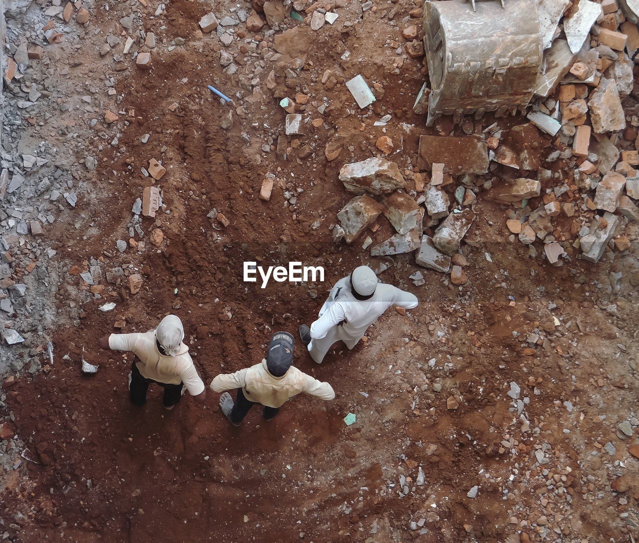 High angle view of men standing at construction site