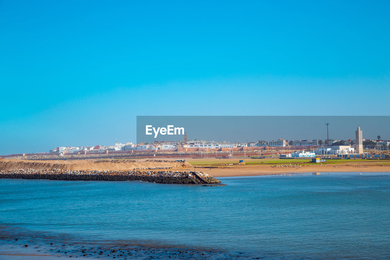 View of sea against clear blue sky