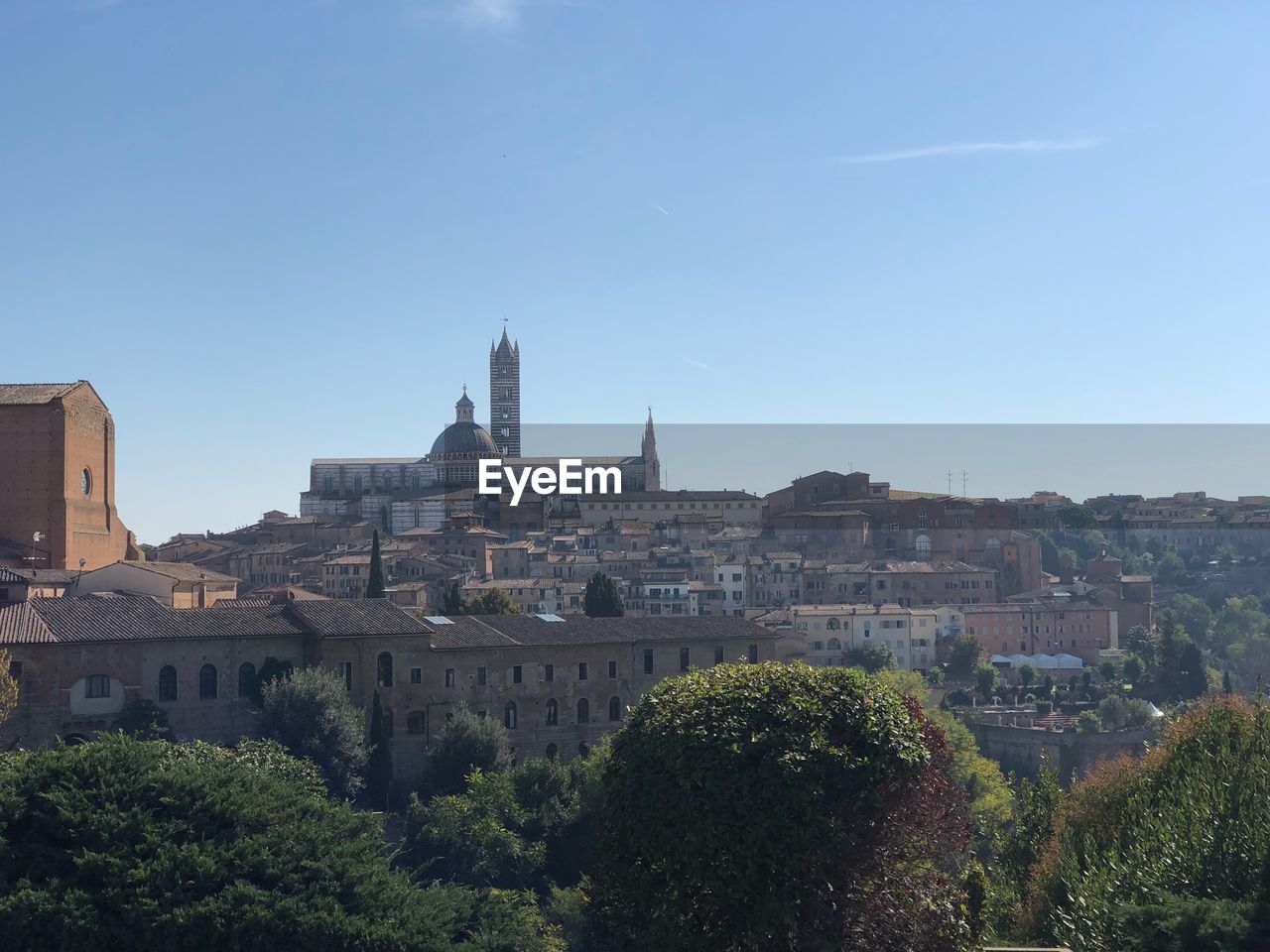 BUILDINGS IN CITY AGAINST SKY