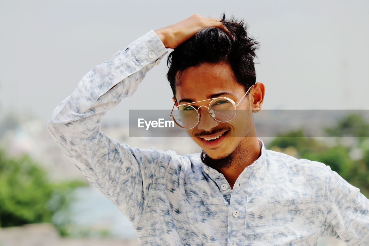 Portrait of young man wearing sunglasses