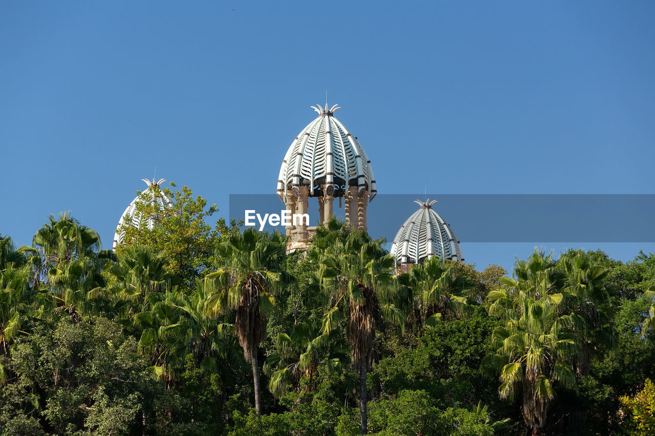 VIEW OF TEMPLE AGAINST TREES