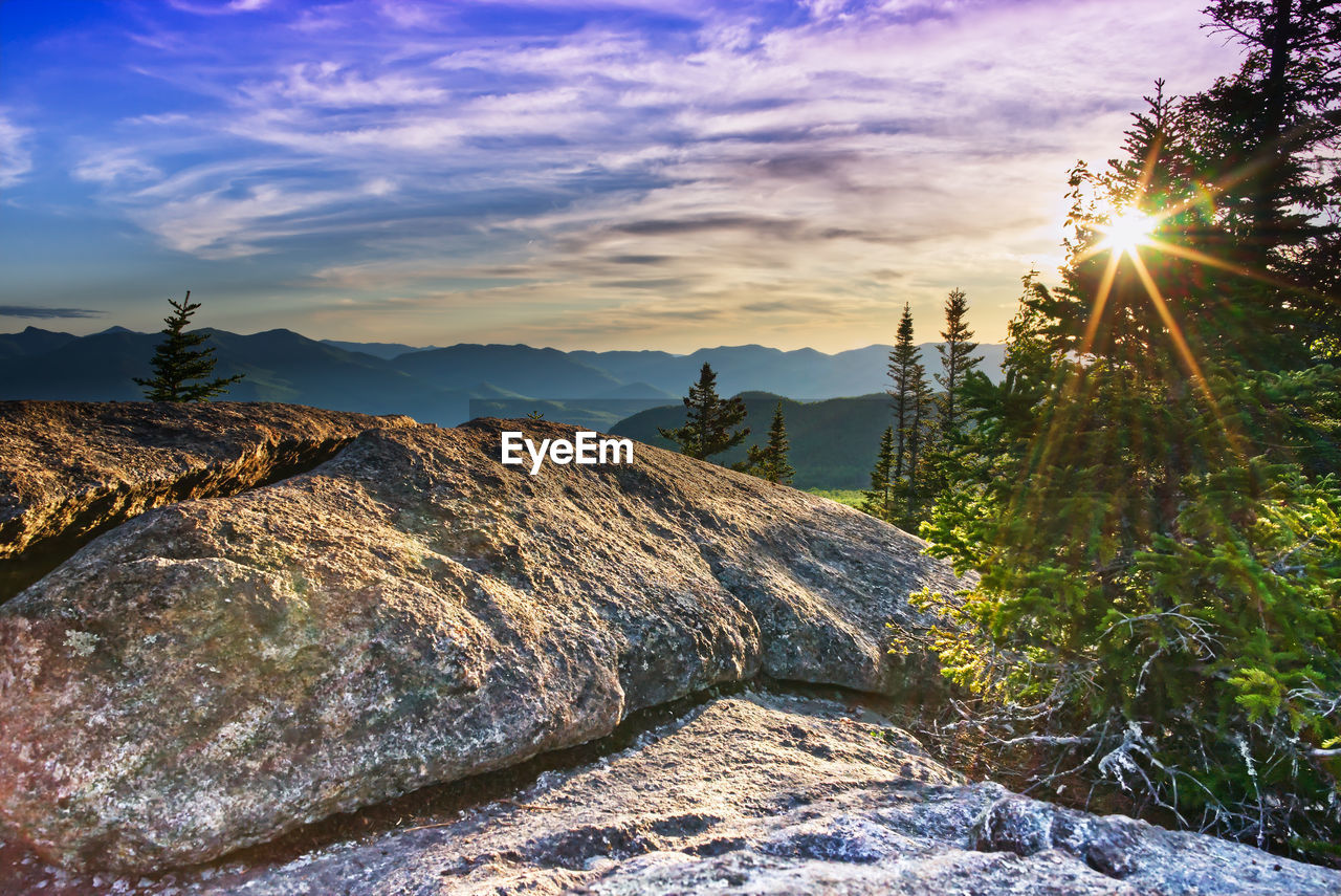 SCENIC VIEW OF ROCKS AGAINST SKY DURING SUNSET