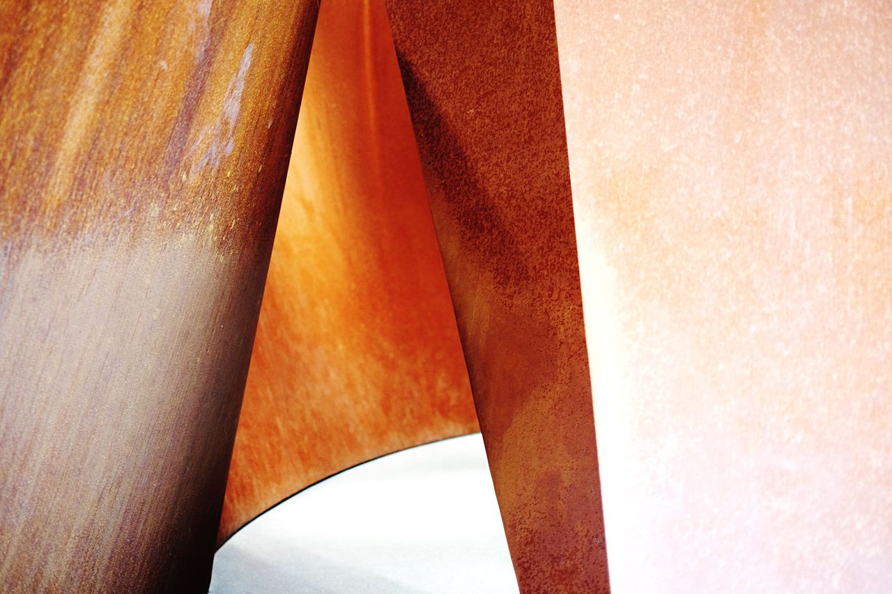 Close-up of table by rusty metal in san francisco museum of modern art