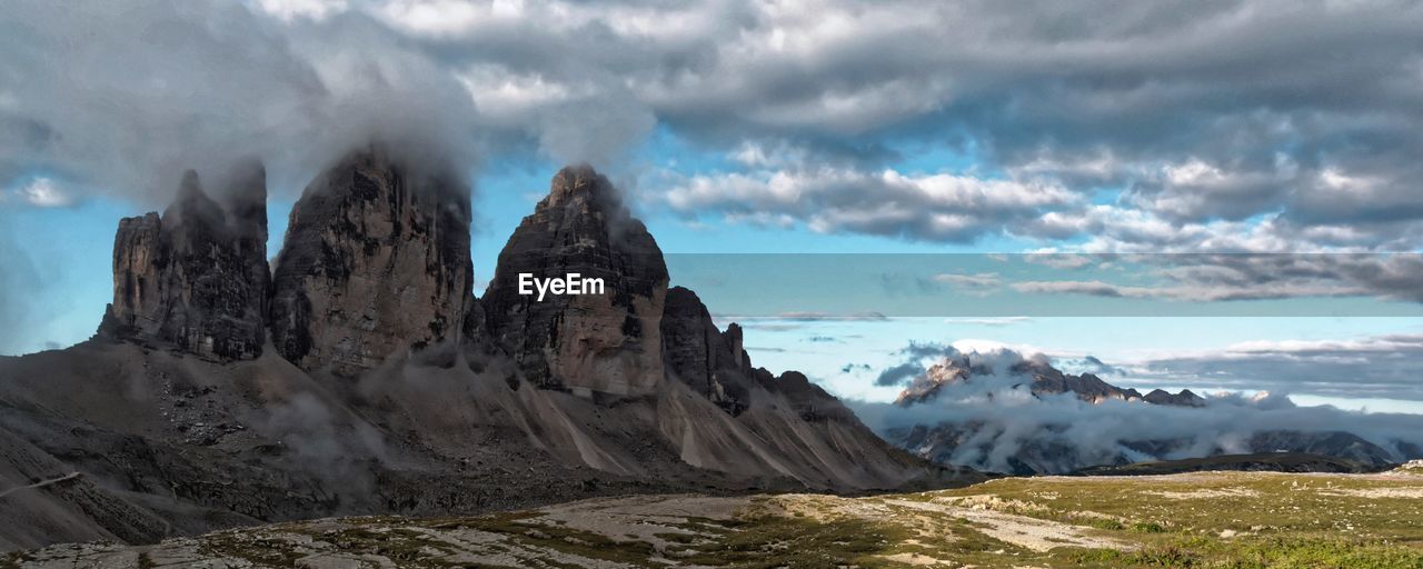 Panoramic view of snowcapped mountains against sky