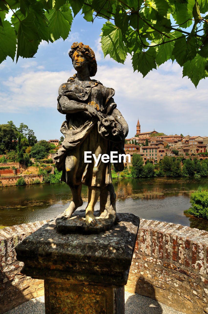 sculpture, statue, architecture, history, nature, the past, water, travel destinations, tree, human representation, religion, representation, plant, travel, craft, built structure, ancient, person, belief, male likeness, tourism, water feature, outdoors, art, ancient history, temple, garden, sky, temple - building, stone material, city, spirituality, day, memorial, creativity