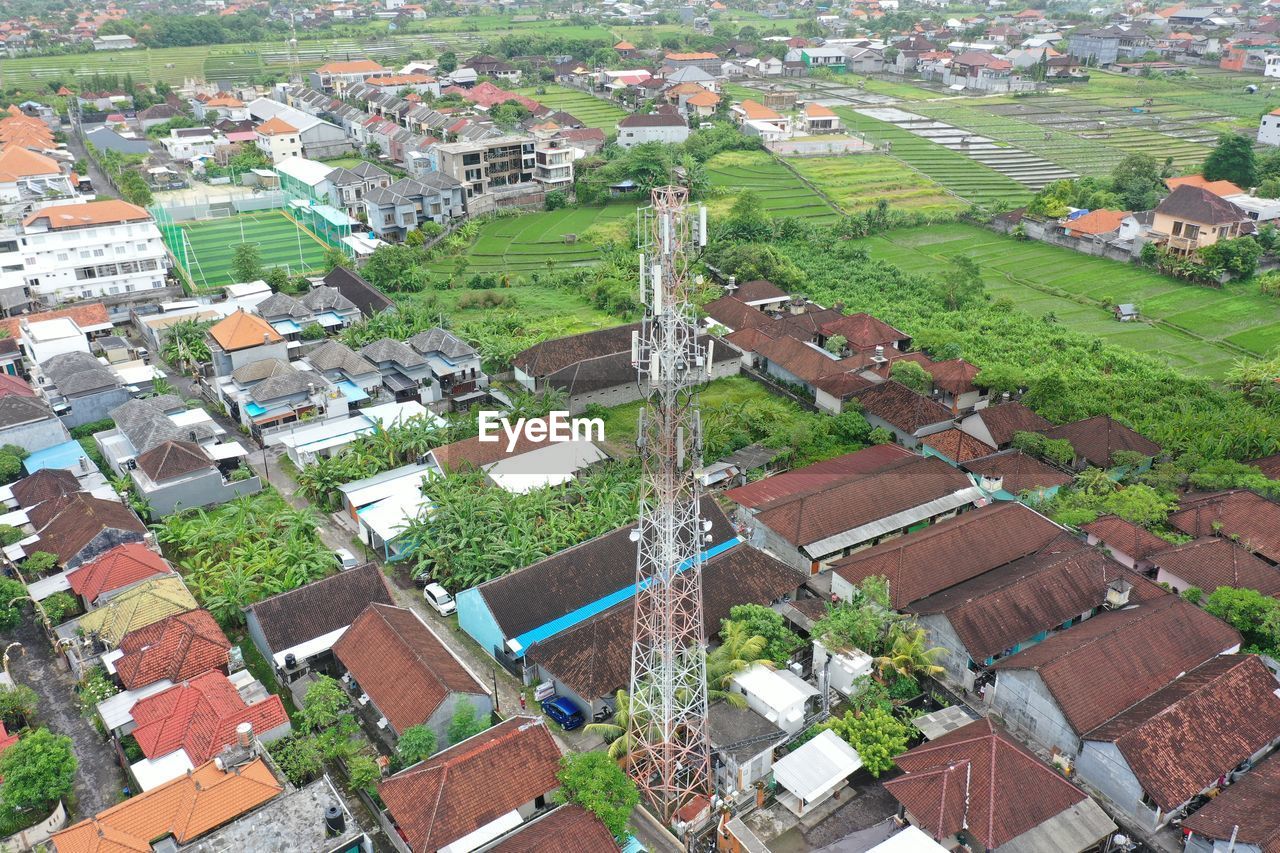 residential area, aerial photography, suburb, bird's-eye view, neighbourhood, high angle view, town, architecture, building exterior, built structure, building, city, aerial view, residential district, environment, landscape, roof, day, house, plant, nature, agriculture, village, no people, field, land, outdoors, rural scene, green, community, growth, cityscape, scenics - nature, farm, tree, estate, patchwork landscape, beauty in nature