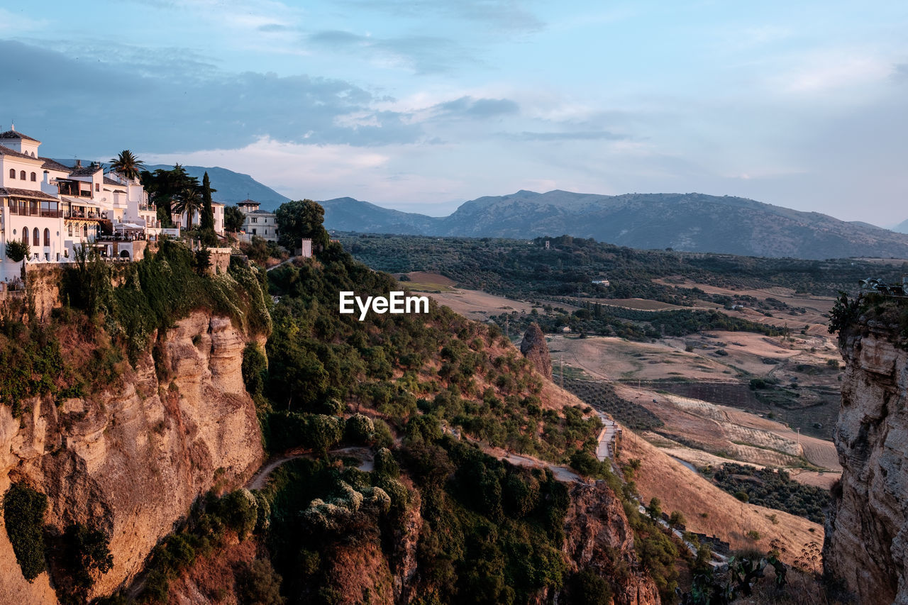 SCENIC VIEW OF LANDSCAPE AND MOUNTAINS AGAINST SKY