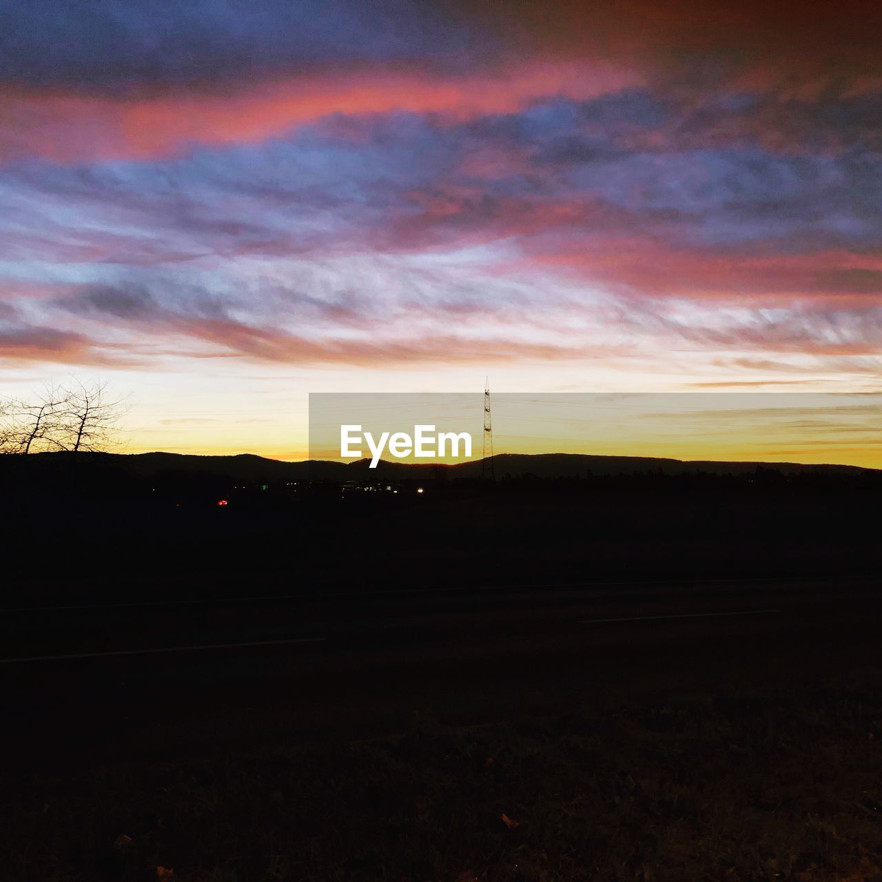 SILHOUETTE LANDSCAPE AGAINST SKY DURING SUNSET