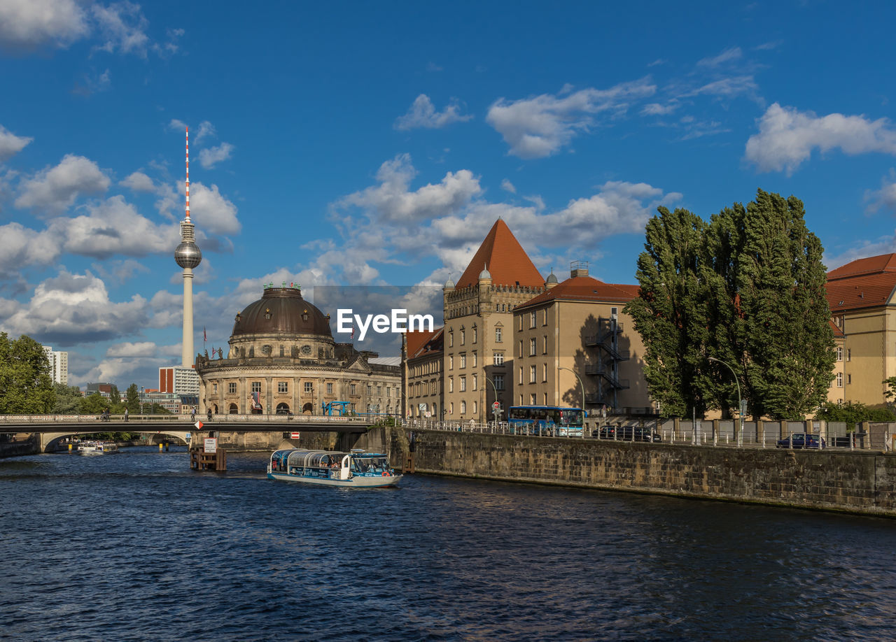 VIEW OF BUILDINGS BY RIVER