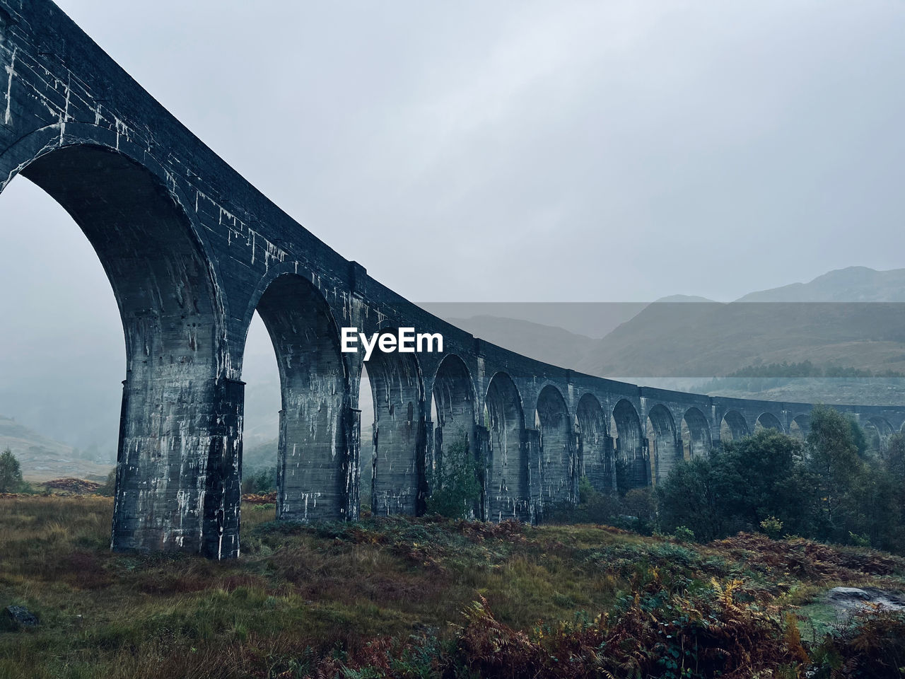 Viaduct against mountains