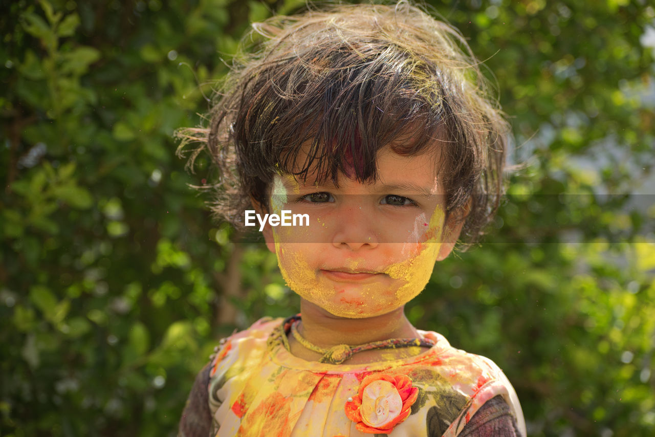 Close-up portrait of boy during holi