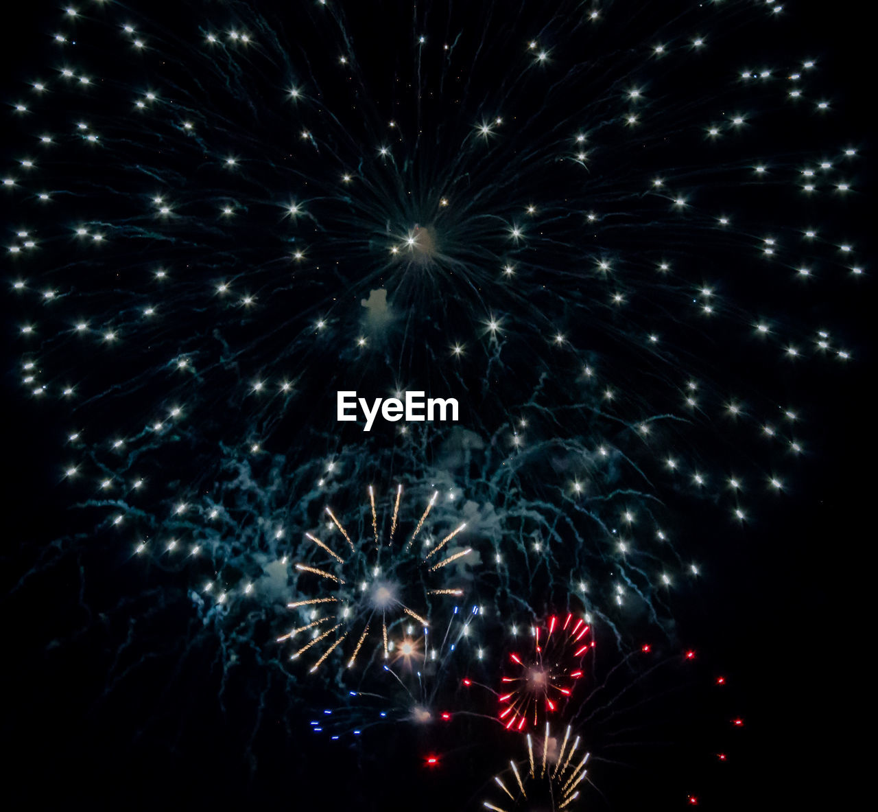 LOW ANGLE VIEW OF FIREWORKS DISPLAY