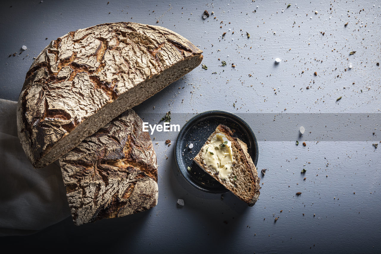 Slice of brown rye bread on table