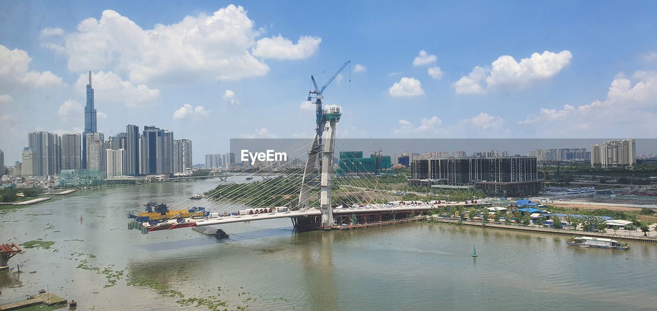PANORAMIC VIEW OF BUILDINGS AND CITY AGAINST SKY