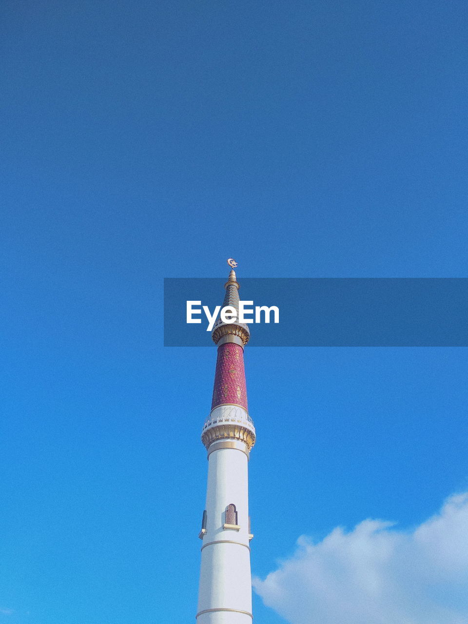 LOW ANGLE VIEW OF TOWER AGAINST BLUE SKY