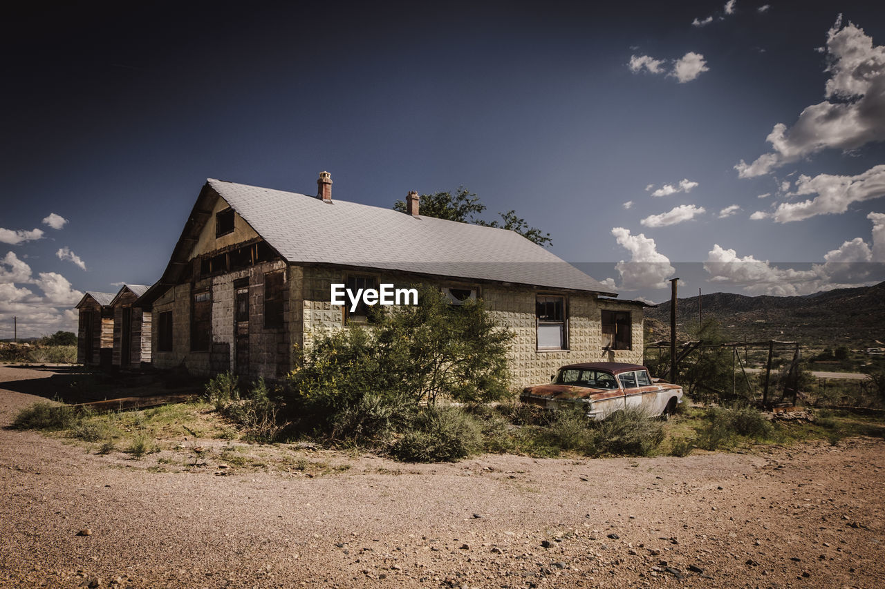 Abandoned house against sky in the desert