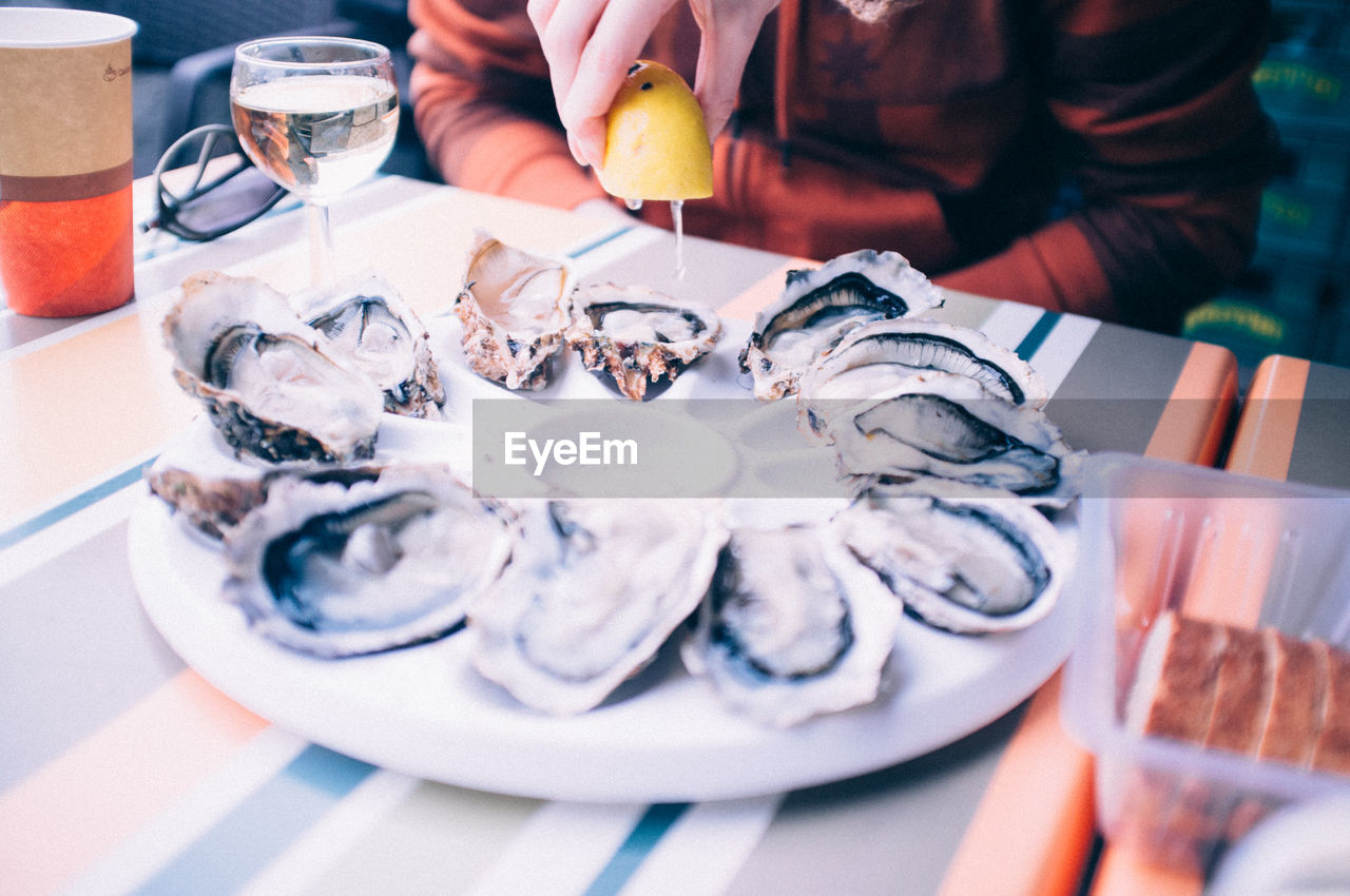 Oyster served with white wine in a restaurant