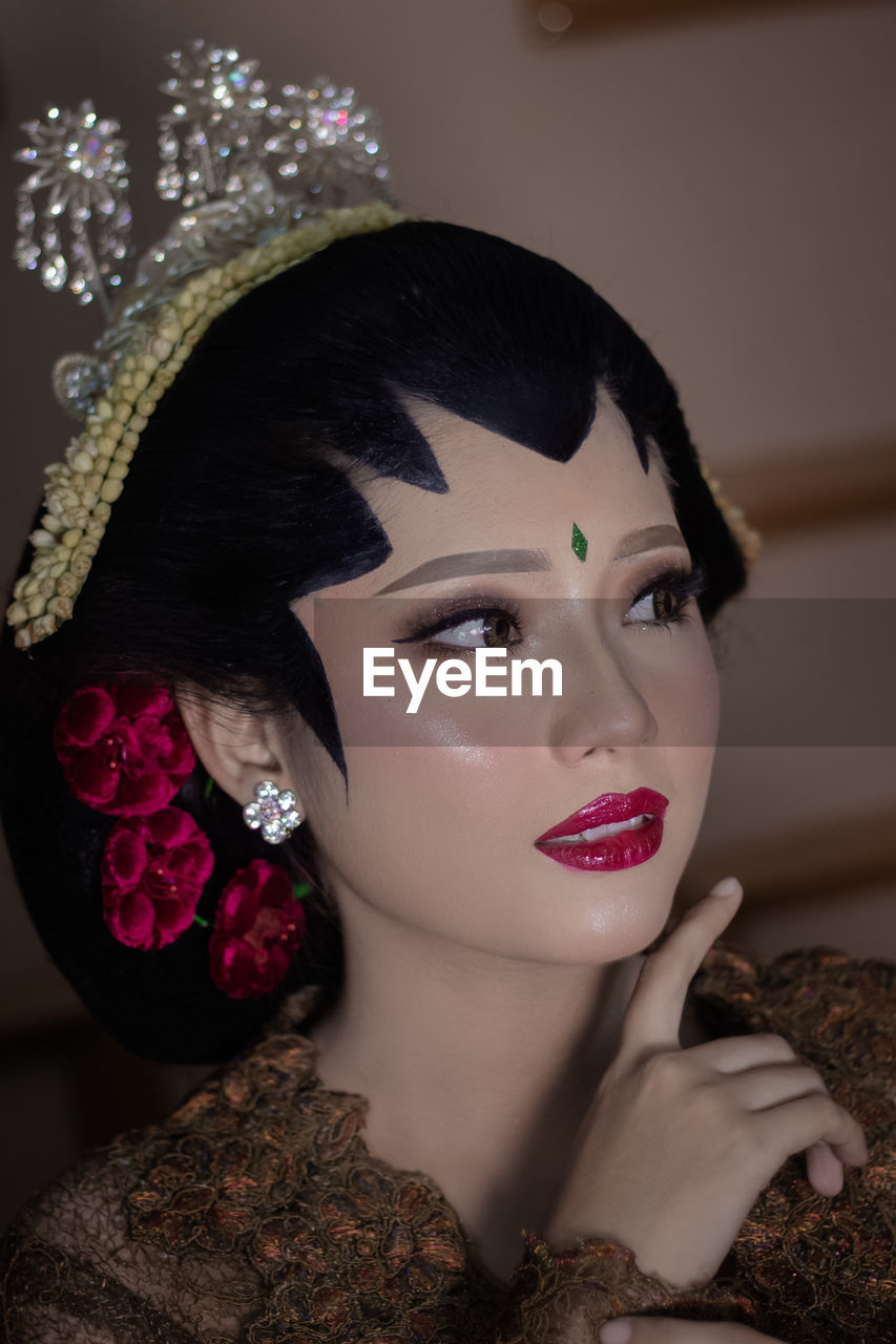 Close-up of young woman with javanese makeup