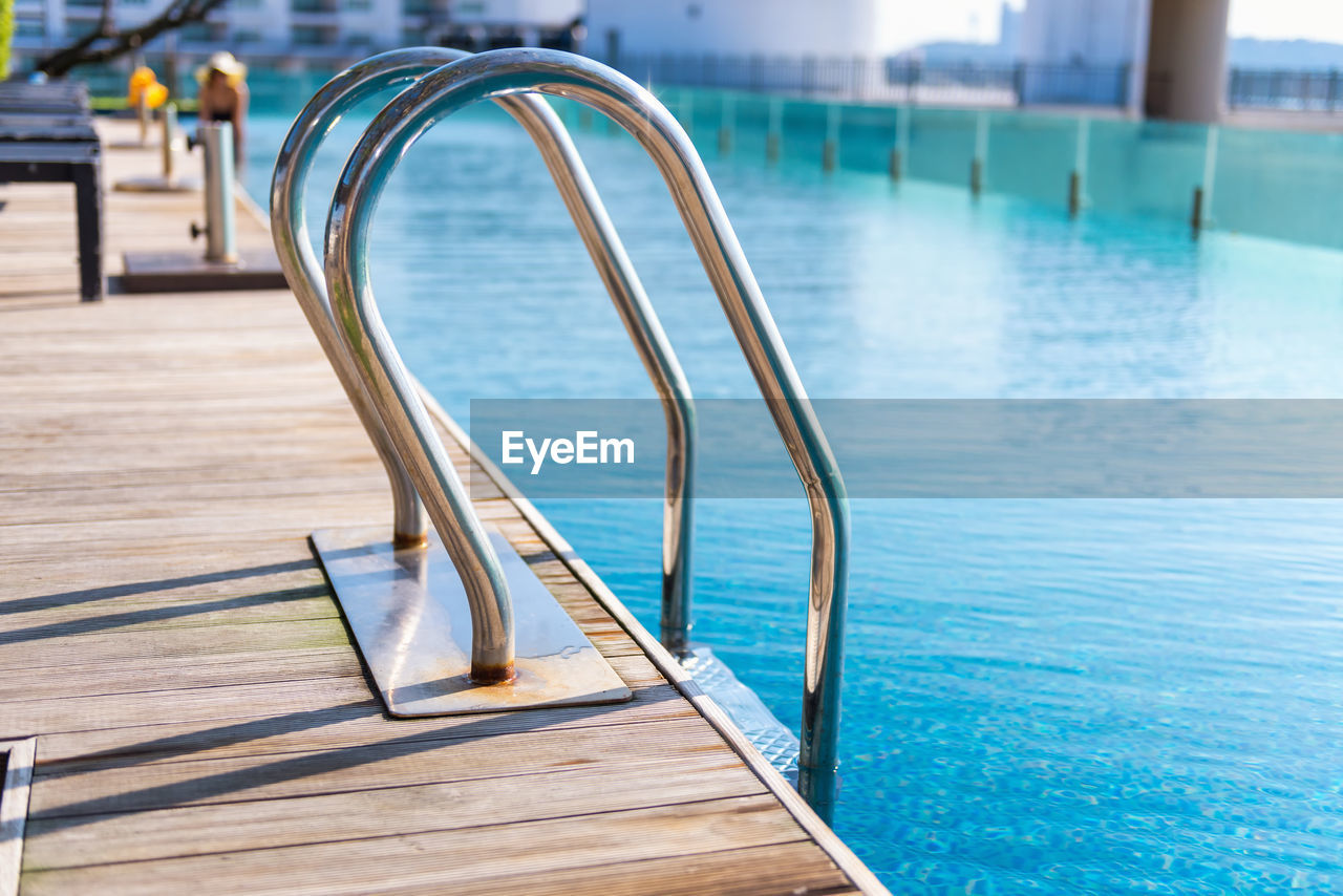 CLOSE-UP OF EMPTY SWIMMING POOL IN WATER