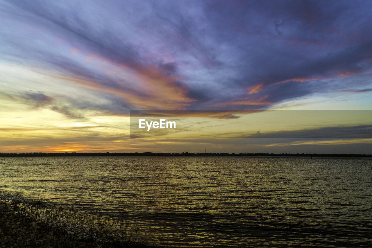 SCENIC VIEW OF SEA DURING SUNSET