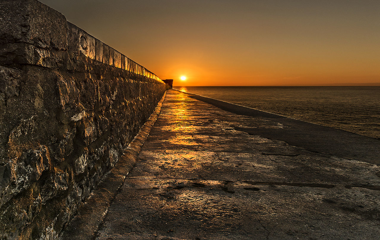 Scenic view of sea at sunset