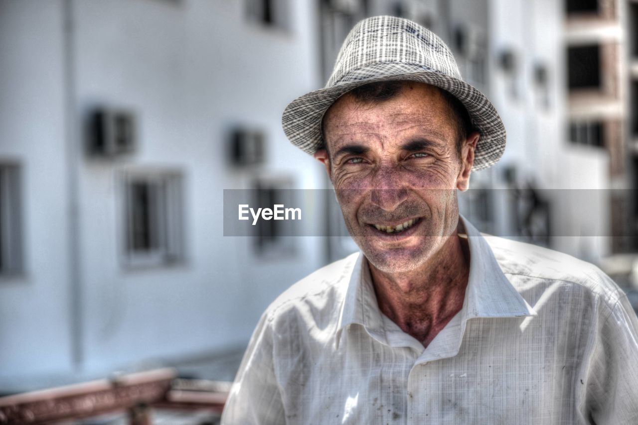 Portrait of senior man wearing hat