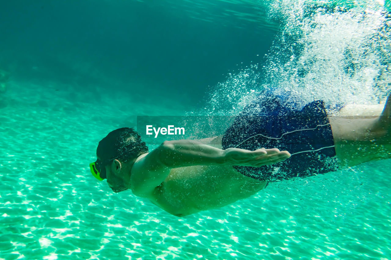 Man swimming in sea