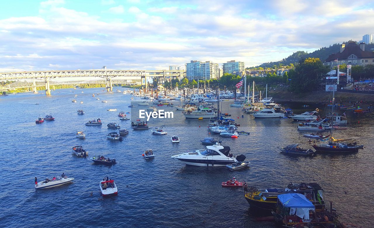 HIGH ANGLE VIEW OF BOATS MOORED IN HARBOR