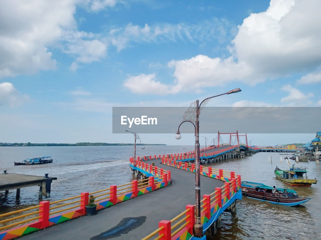 Pier over sea against sky