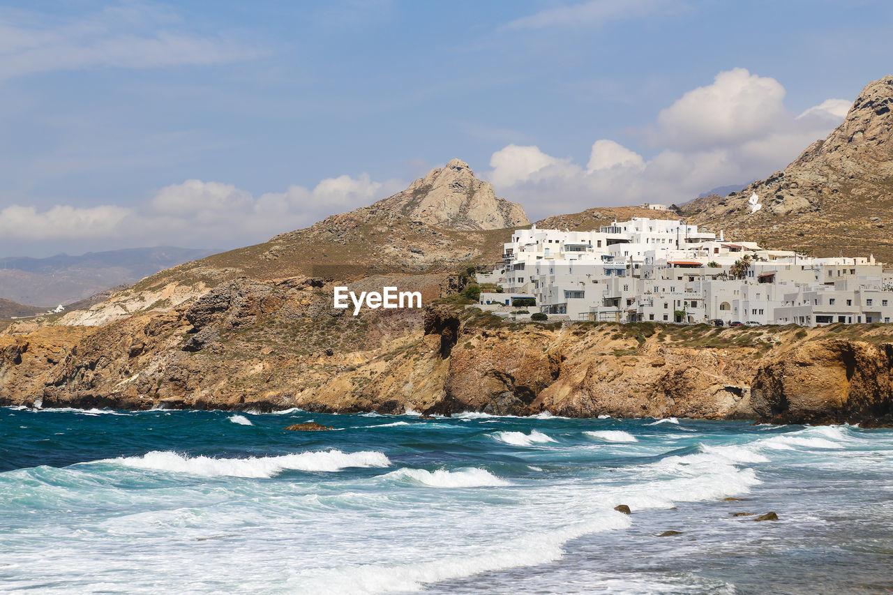 SCENIC VIEW OF SEA AGAINST BUILDINGS