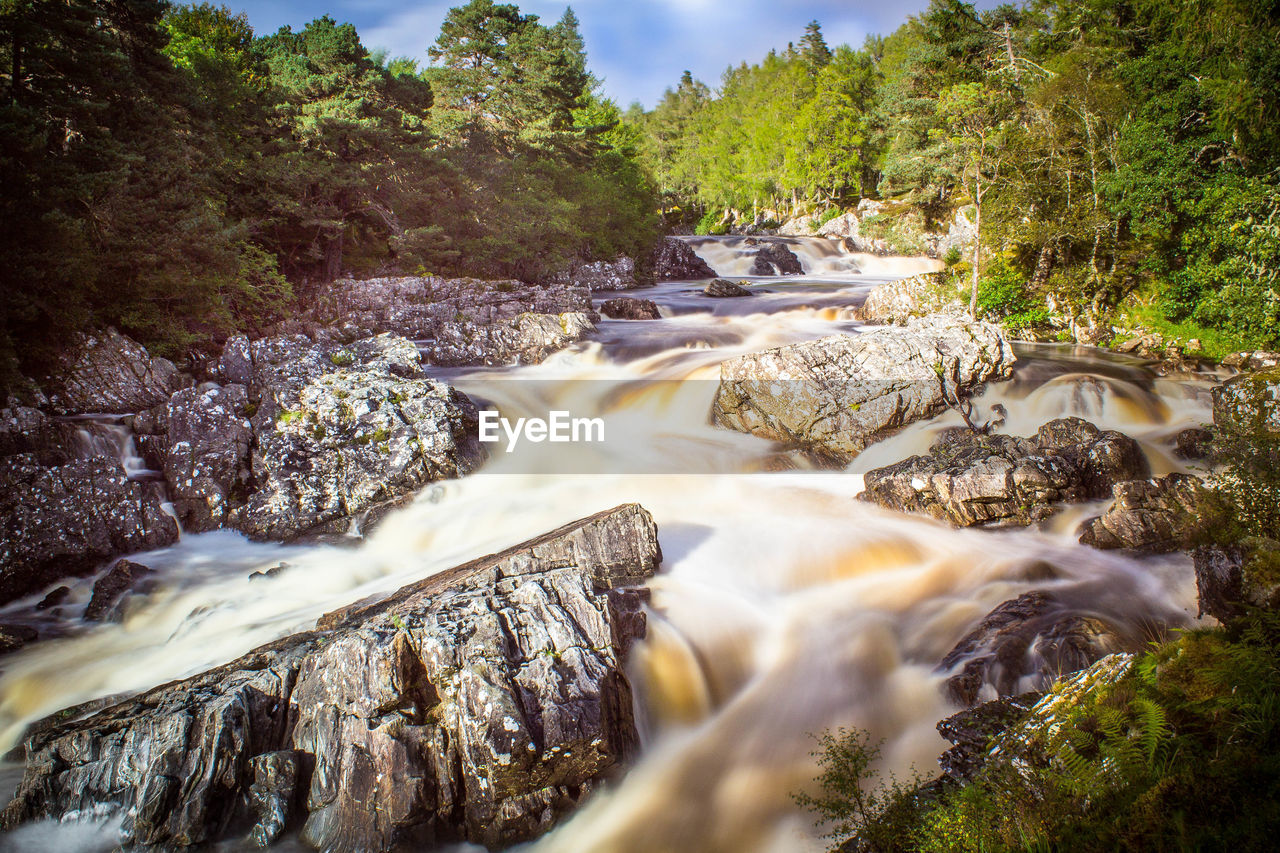 Scenic view of river amidst rock formations